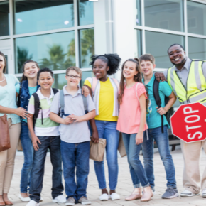 A crossing guard with students